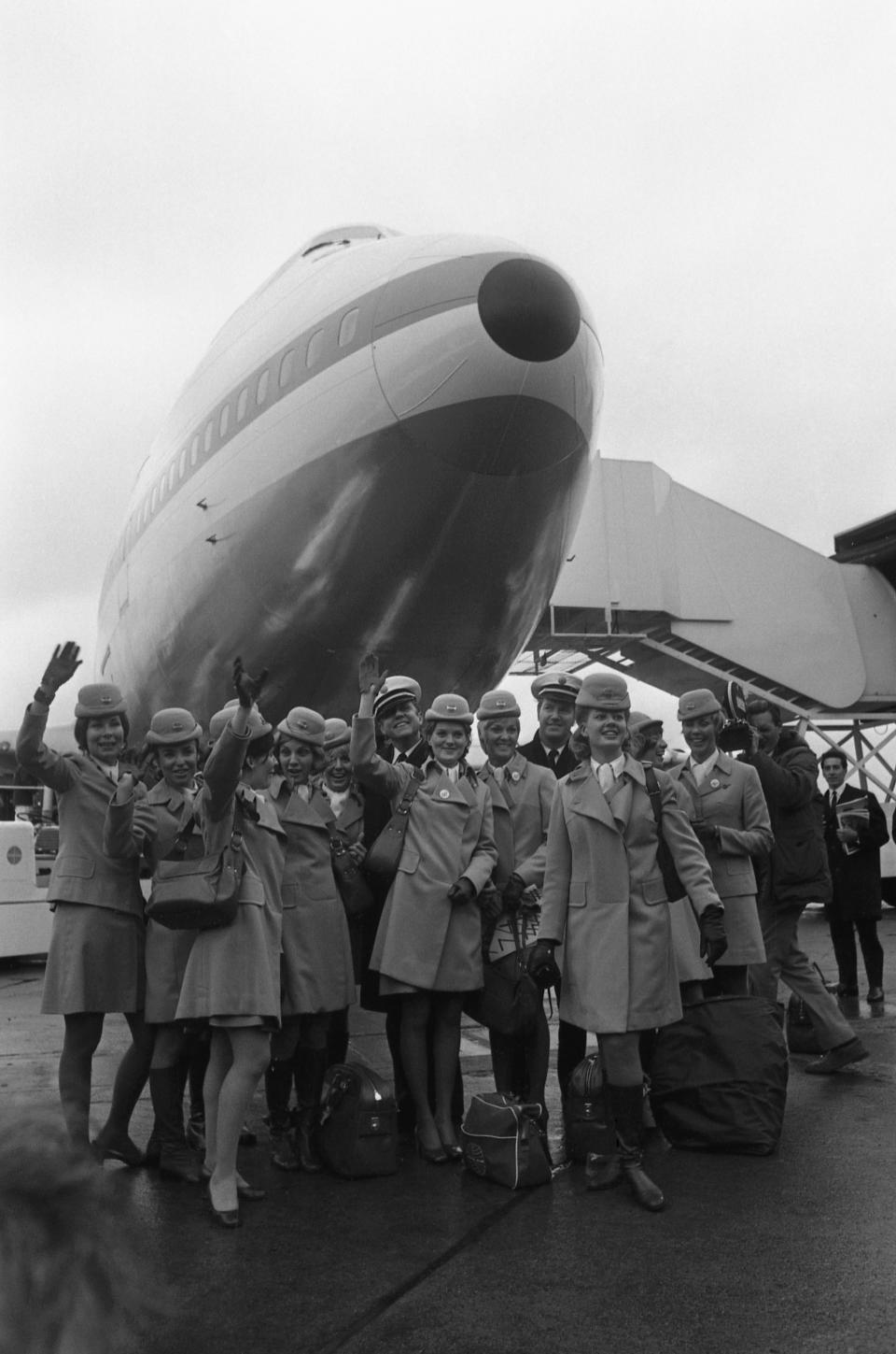 FILE - The crew of a Boeing 747 Jumbo Jet pose in front of the nose of the plane at London's Heathrow Airport in England on Jan. 12, 1970. The 360 seat jet was the first of its kind to complete a transatlantic crossing. Boeing bids farewell to an icon on Tuesday, Jan. 31, 2023, when it delivers the jumbo jet to cargo carrier Atlas Air. Since it debuted in 1969, the 747 has served as a cargo plane, a commercial aircraft capable of carrying nearly 500 passengers, and the Air Force One presidential aircraft, but it has been rendered obsolete by more profitable and fuel-efficient models. (AP Photo, File)