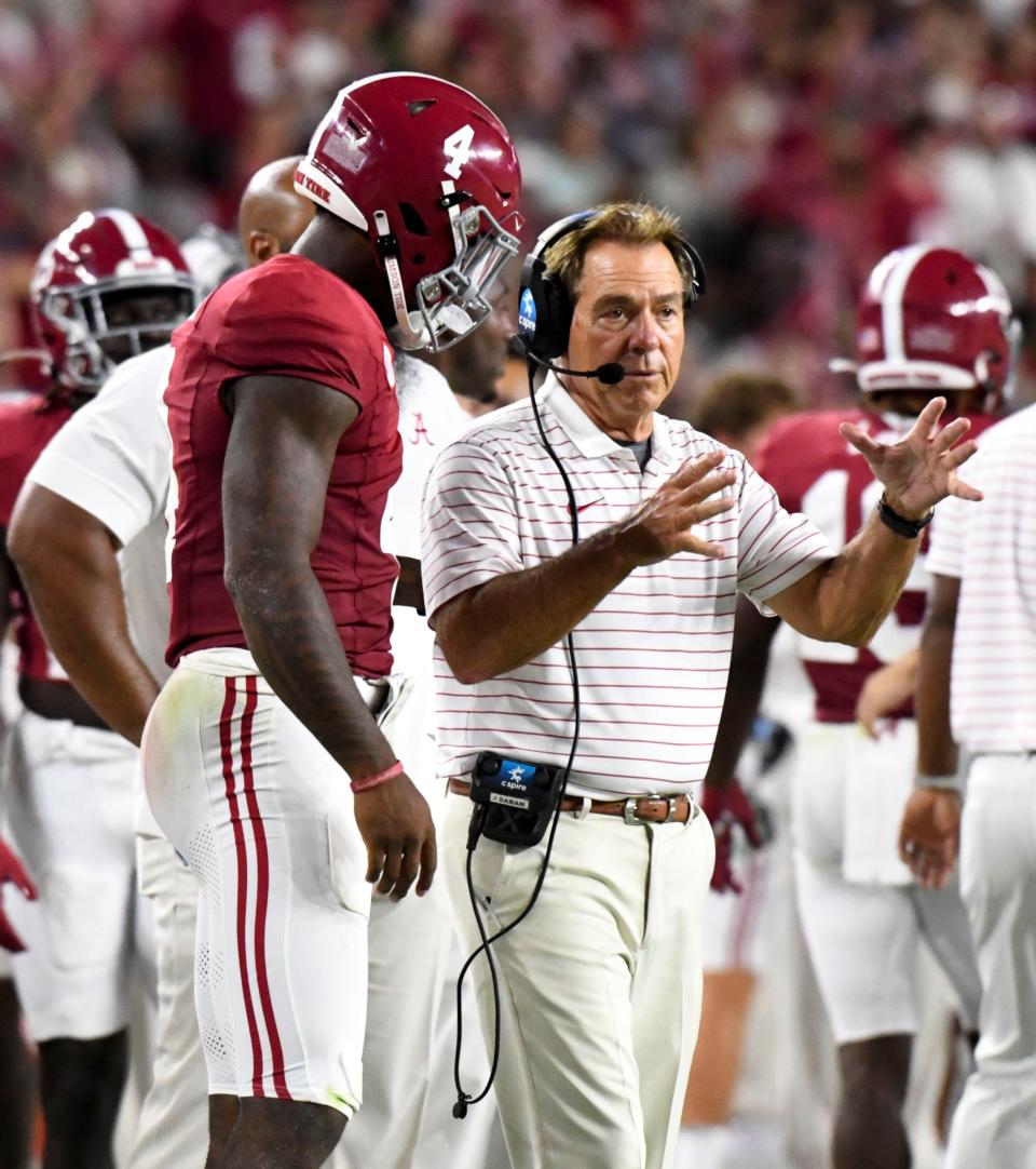 Alabama head coach Nick Saban talks to quarterback Jalen Milroe after Milroe had thrown a touchdown during last week's 56-7 win over Middle Tennessee. Only a couple of years ago, though, Milroe was a high school senior committed to Texas and current Texas coach Steve Sarkisian was running Saban's offense at Alabama.