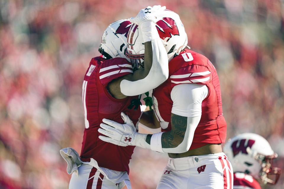 Wisconsin's Skyler Bell, left, and teammate Braelon Allen celebrate Bell's touchdown against Purdue during the first half of an NCAA college football game Saturday, Oct. 22, 2022, in Madison, Wis. (AP Photo/Andy Manis)