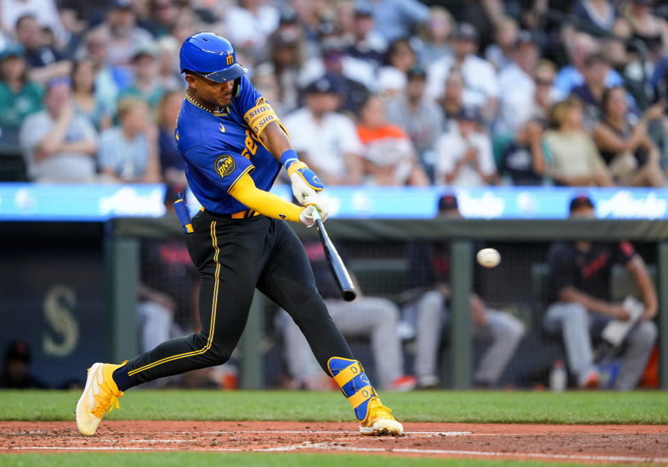 Seattle Mariners' Julio Rodriguez hits a single against the Detroit Tigers during the fourth inning of a baseball game Friday, July 14, 2023, in Seattle. (AP Photo/Lindsey Wasson)