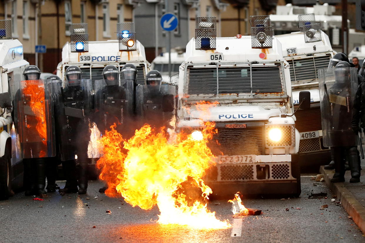 A fire burns in front of the police on the Springfield Road as protests continue in Belfast, Northern Ireland April 8, 2021. REUTERS/Jason Cairnduff     TPX IMAGES OF THE DAY