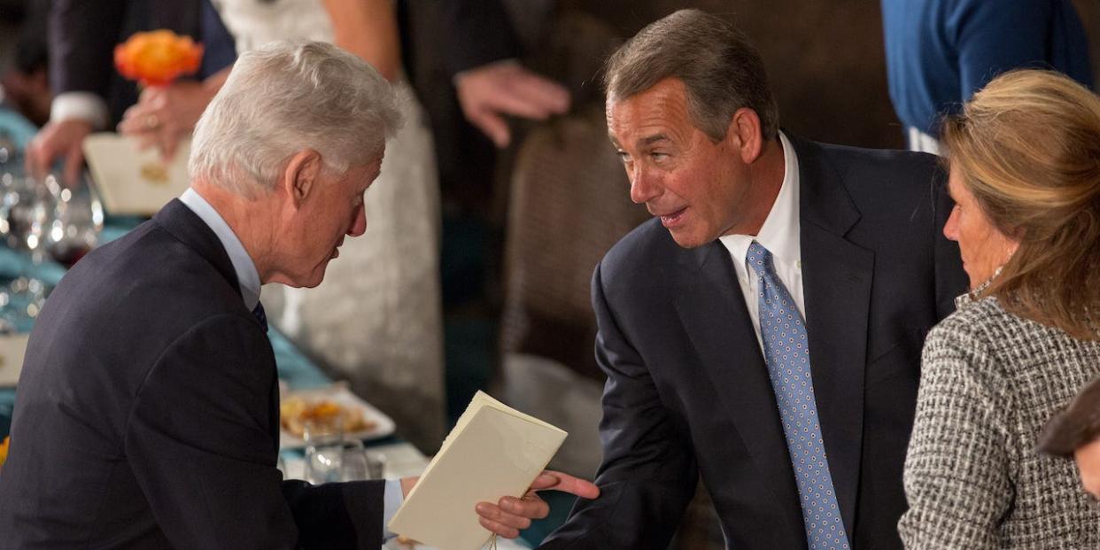 Former U.S. President Bill Clinton shakes hands with House Speaker John Boehner at the Inaugural Luncheon in Statuary Hall on Inauguration day at the U.S. Capitol building January 21, 2013 in Washington D.C.