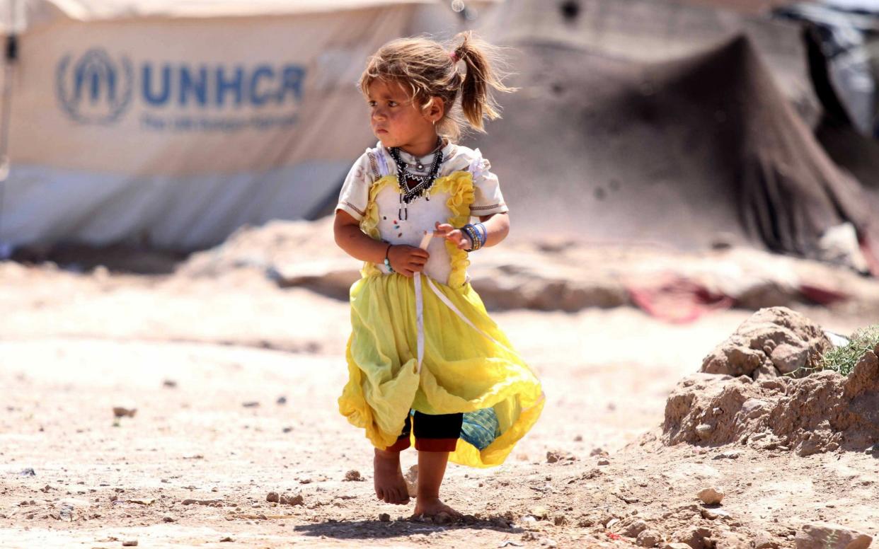 A young girl in Afghanistan living in a temorary refugee camp - REX