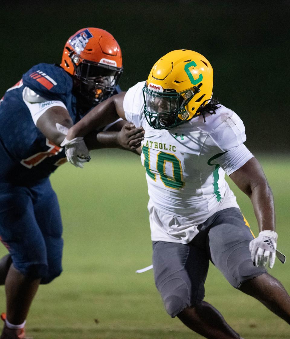 Courtney Clark (10) tries to get to the quarterback during the Pensacola Catholic vs Escambia football game at Escambia High School in Pensacola on Friday, Sept. 1, 2023.