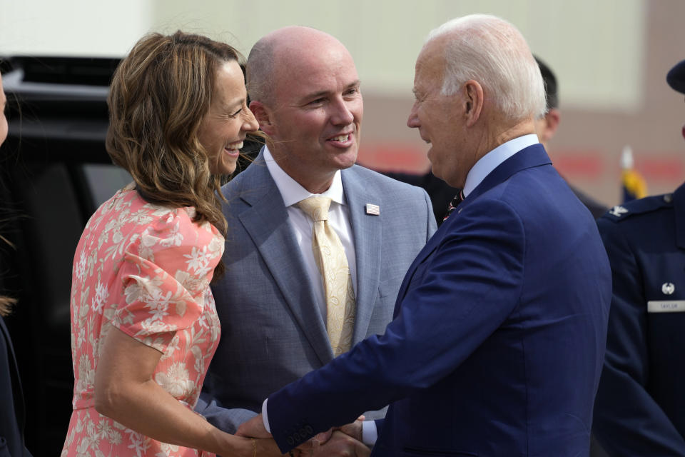 Utah Gov. Spencer Cox and his wife Abby Cox greet President Joe Biden after he arrives at Roland R. Wright International Guard Base, Wednesday, Aug. 9, 2023, in Salt Lake City. (AP Photo/Alex Brandon)