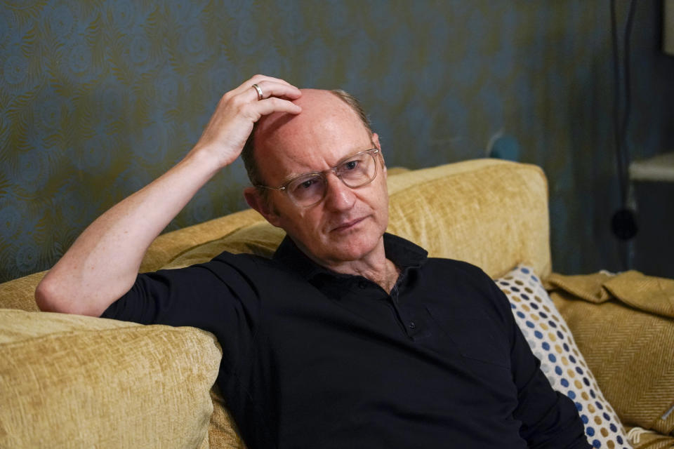 Mark Gatiss is photographed during an interview with The Associated Press at a theater, in London, Thursday, March 14, 2024. The turbulent union of actors Richard Burton and Elizabeth Taylor that set gossip columns aflame are the subjects of “The Motive and the Cue,” a play that is being broadcast in cinemas in Britain and internationally starting Thursday as part of the National Theatre Live series. The play looks at a famous 1964 production of “Hamlet” that starred Burton and was directed by John Gielgud. Mark Gatiss plays Gielgud in the witty and moving look at fame’s fickleness and cost. (AP Photo/Alberto Pezzali)