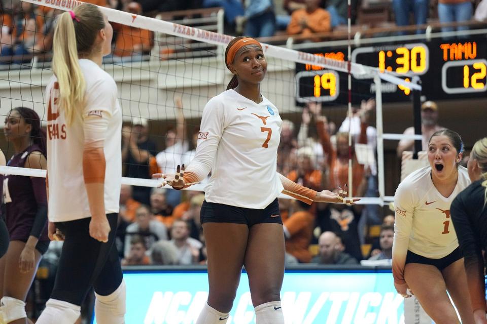 Texas middle blocker Asjia O'Neal reacts after scoring a point during the Longhorns' NCAA Tournament-opening win over Texas A&M. She wrapped up her six-year Longhorns career by serving an ace on match point in Sunday's NCAA championship win over Nebraska.