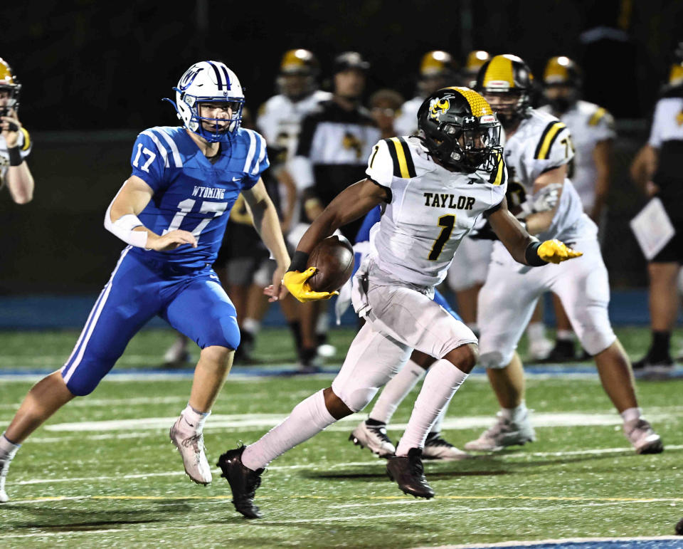 Taylor kick returner Aaron McFarland runs the ball during their 31-0 loss to Wyoming Friday, Sept. 15, 2023.