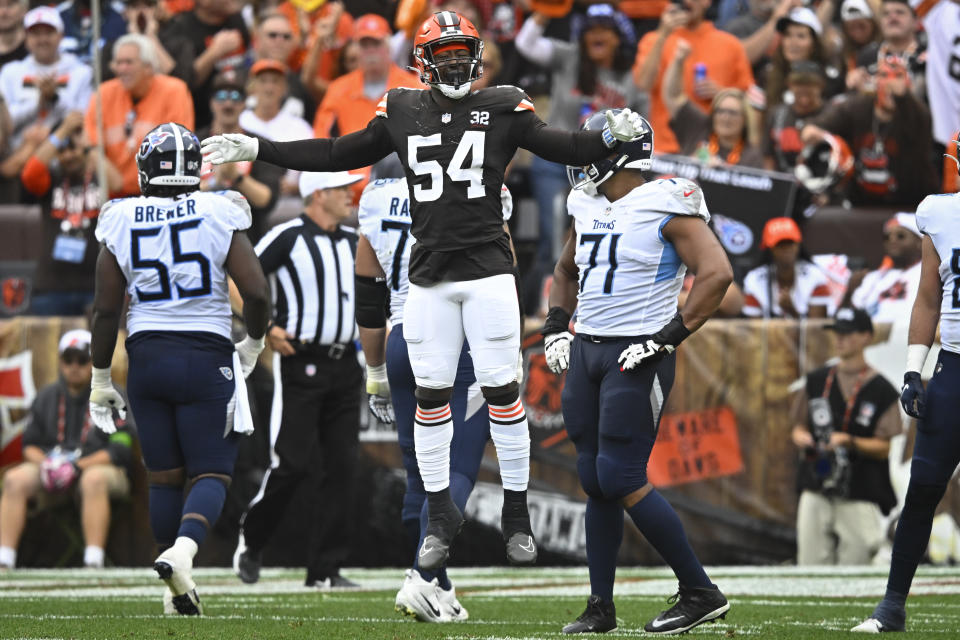 Cleveland Browns defensive end Ogbo Okoronkwo (54) celebrates a defensive stop against the Tennessee Titans during the second half of an NFL football game Sunday, Sept. 24, 2023, in Cleveland. (AP Photo/David Richard)