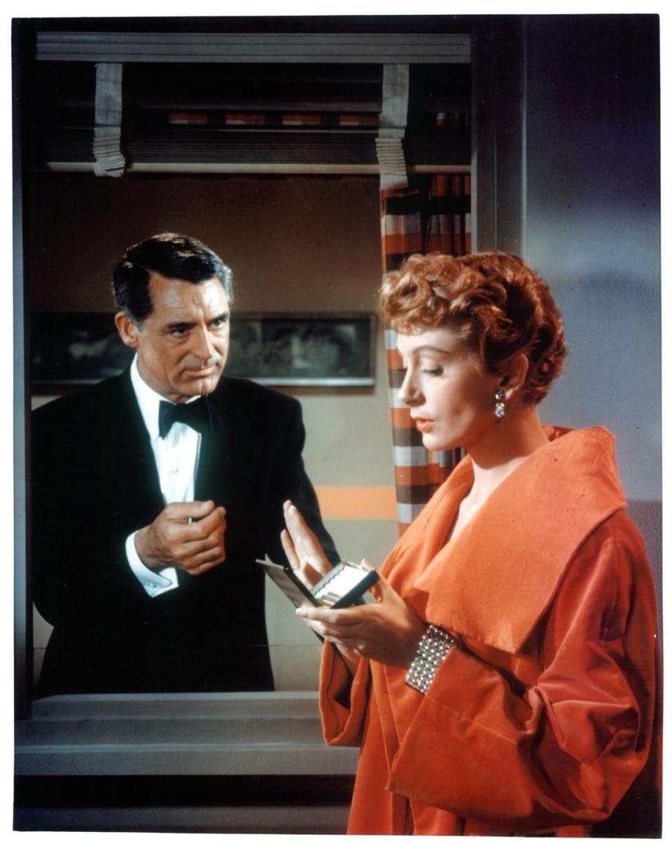 <p>Deborah Kerr's multi-strand pearl bracelet stands out against her tangerine coat in a memorable scene from <em>An Affair to Remember</em>. </p>