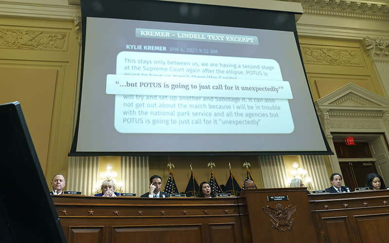 A text message is displayed during a House committee hearing