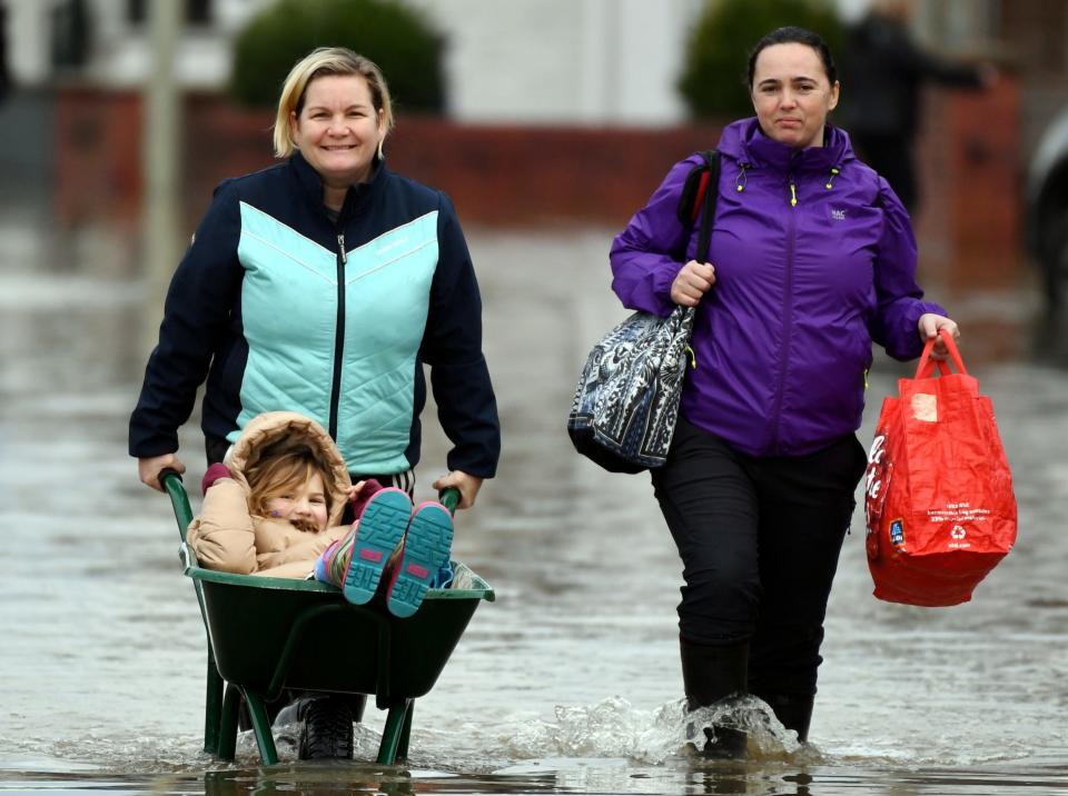 People in Longford near Gloucester tackle the flood water in a creative way