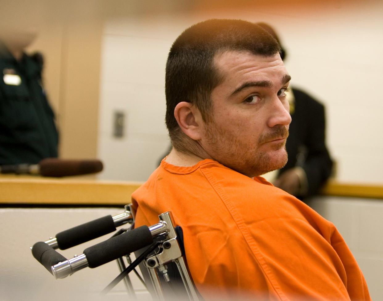 Jason Wheeler, who was later condemned for the murder of Lake County Sheriff's Deputy Wayne Koester, looks back towards a group of journalist while he attended a pre-trial hearing Wednesday May 10, 2006 in a courtroom in the Lake County Jail.