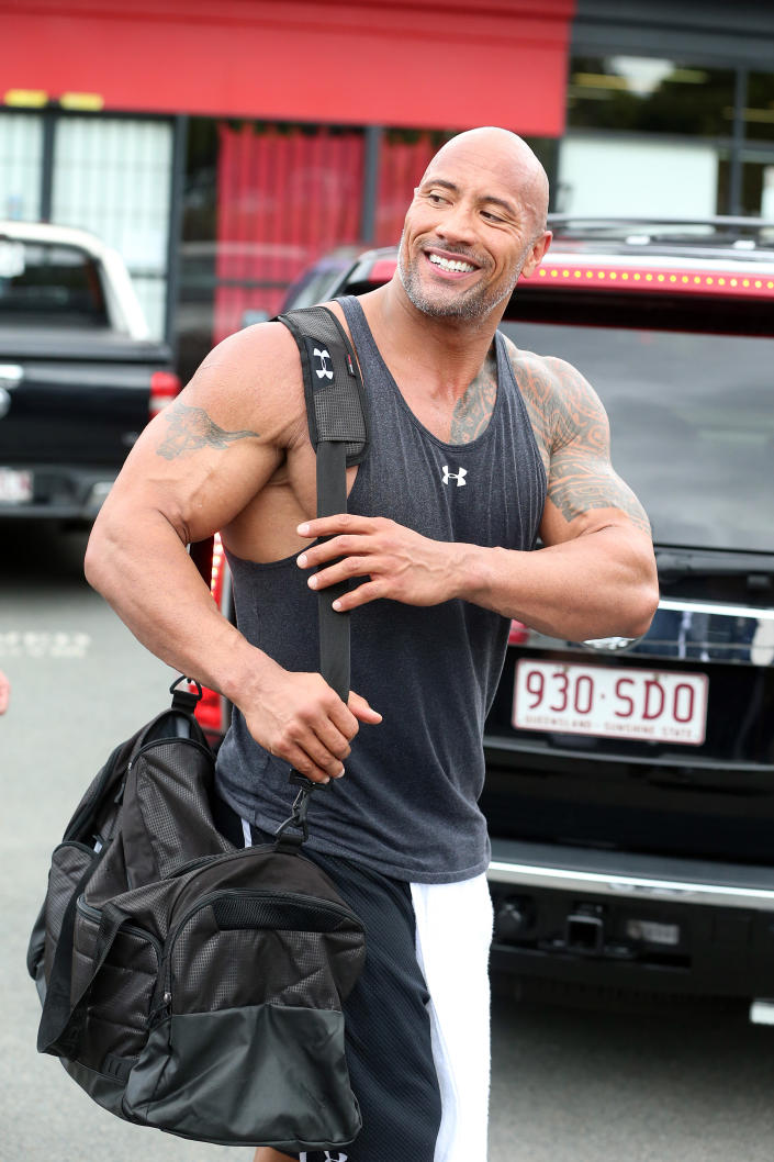 Dwayne Johnson, cunoscut și sub numele de & # 39;  The Rock & # 39;  , apare după un antrenament la World Gym, Ashmore pe 14 aprilie 2014 în Gold Coast, Australia.  (Newspeaks/Getty Images)