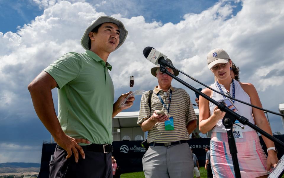 Professional golfer Zecheng "Marty" Dou enjoys a Dilly bar during interviews after winning The Ascendant at TPC Colorado in Berthoud, Colo. on Sunday, July 3, 2022.