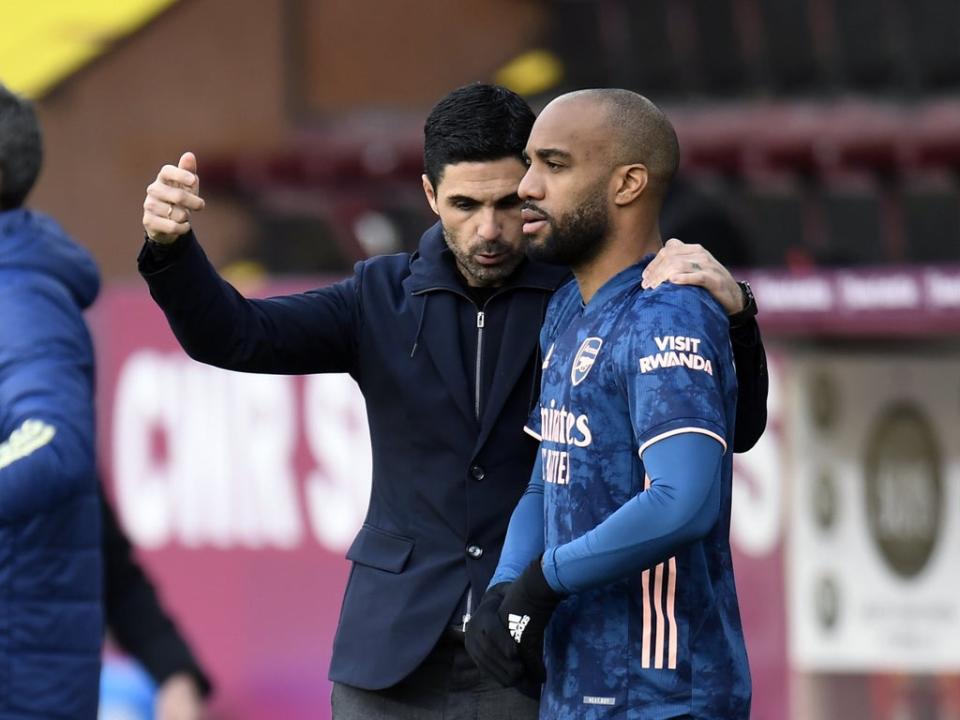 Arsenal manager Mikel Arteta, left, has spoken on Alexandre Lacazette’s contract issue (Peter Powell/PA) (PA Archive)