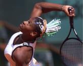 Serena Willams, of the USA, prepares to serve to Dominique van Roost of Belgium in the third round of the French Tennis Open tournament at Roland Garros stadium in Paris Saturday May 30, 1998. Williams won 6-1, 6-1. (AP Photo/Lionel Cironneau)