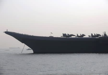 MiG-29 aircraft are seen parked during a media preview on the flight deck of INS Vikramaditya, Indian Navy's aircraft carrier, anchored in the Arabian Sea off the coast of Mumbai, India, in this December 3, 2015 file photo. REUTERS/Shailesh Andrade/Files