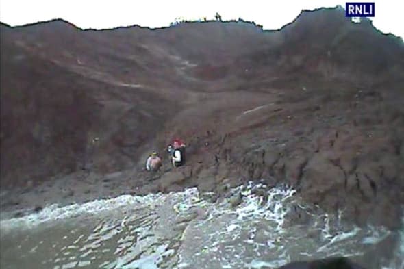 Dramatic rescue of teen girls stuck in thick mud in Kent (pics)