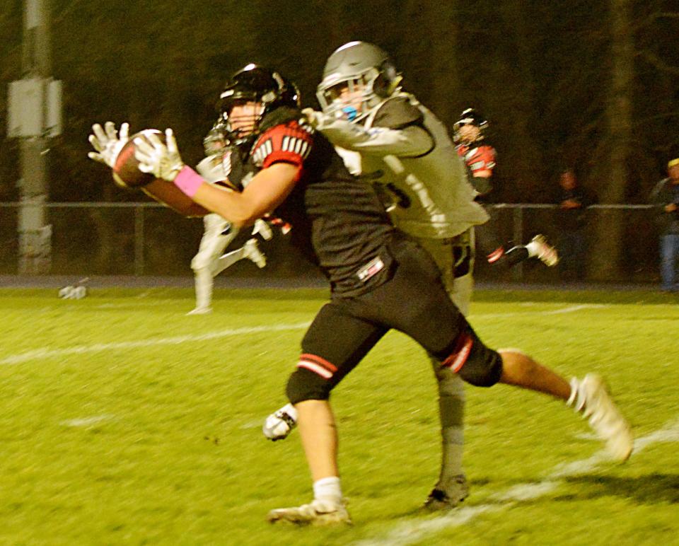 Deuel's Gavin Benck hauls in a catch against St. Thomas More's Tyson Durham during their Class 11B first-round high school playoff game on Thursday, Oct. 20, 2022 in Clear Lake. Deuel won 27-10.