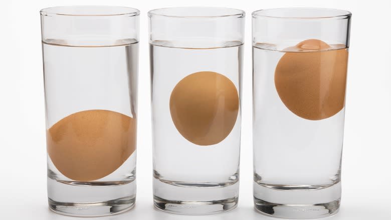 Three glasses water with eggs inside 