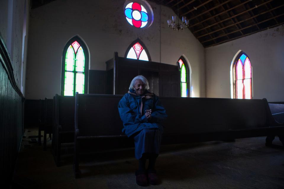 The oldest living member of Zoar Methodist Episcopal Church Lucretia Munson sits for a portrait in the original pews of the church Wednesday, Nov. 24, 2021. 