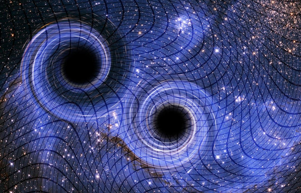 Black holes and other massive objects create ripples in spacetime when they merge. <a href="https://www.gettyimages.com/detail/illustration/black-holes-illustration-royalty-free-illustration/1088377636?phrase=gravitational+waves&adppopup=true" rel="nofollow noopener" target="_blank" data-ylk="slk:Victor de Schwanburg/Science Photo Library via Getty Images;elm:context_link;itc:0;sec:content-canvas" class="link ">Victor de Schwanburg/Science Photo Library via Getty Images</a>