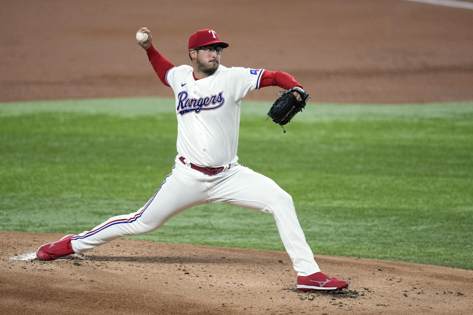 Texas Rangers relief pitcher Dane Dunning throws to a St. Louis Cardinals batter during the second inning of a baseball game Tuesday, June 6, 2023, in Arlington, Texas. (AP Photo/Tony Gutierrez)