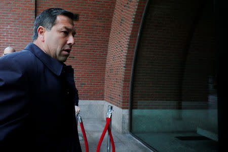 Jorge Salcedo, the former men's soccer head coach at the University of California at Los Angeles (UCLA) facing charges in a nationwide college admissions cheating scheme, arrives at the federal courthouse in Boston, Massachusetts, U.S., March 25, 2019. REUTERS/Brian Snyder