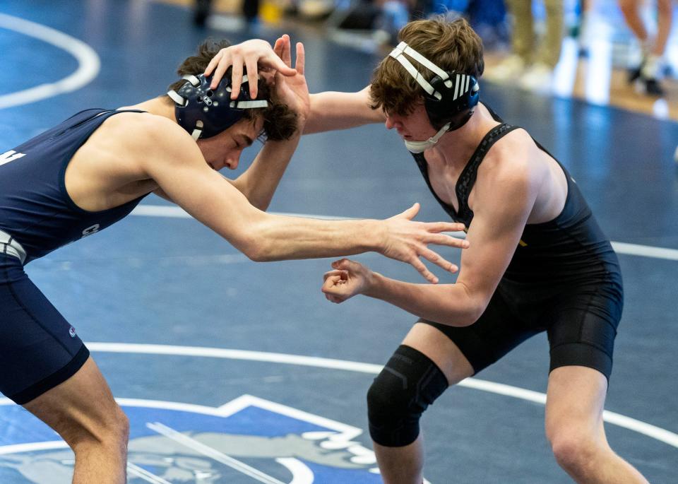 Central Bucks West's Patrick Kelly (right), shown here wrestling Council Rock North's Justin Swope at the PIAA District One East Class 3A tournament, placed second at 139 pounds Saturday.