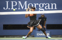 Naomi Osaka, of Japan, returns a shot to Anna Blinkova, of Russia, during the first round of the US Open tennis tournament Tuesday, Aug. 27, 2019, in New York. (AP Photo/Michael Owens)