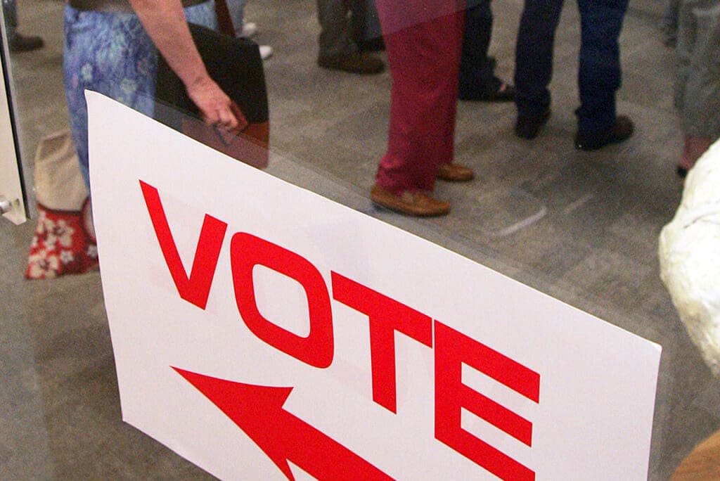 FILE – Voters stand in line waiting for ballot for the North Carolina primary at a library in Raleigh, N.C., on May 6, 2008. Tens of thousands of people serving punishments for felony convictions in North Carolina but who aren’t behind bars can now register to vote and cast ballots following an appeals court ruling. Expanding the scope of those able to register and vote began on Wednesday, July 27, 2022, the State Board of Elections said. (AP Photo/Jim R. Bounds, File)