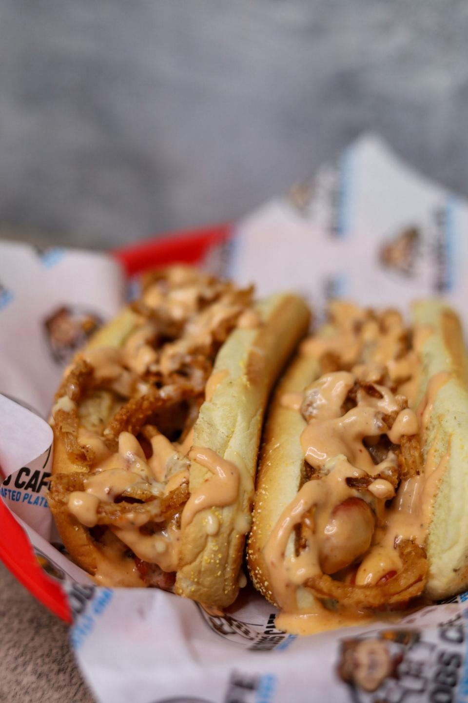 Hot dogs topped with queso, frizzled onions and "Big Dog Sauce" at Big Dogs Cafe in Toms River.