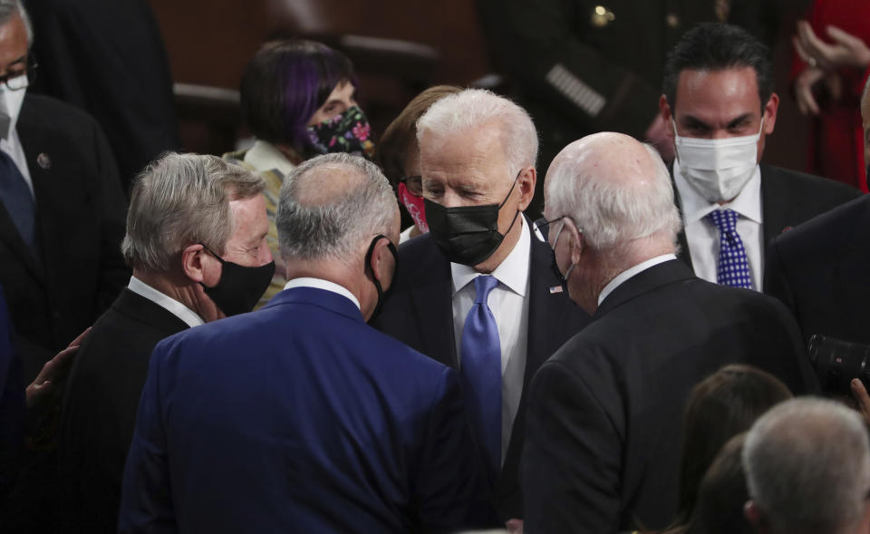 President Joe Biden speaks to Sen. Dick Durbin, D-Ill.,, left, Senate Majority Leader Chuck Schumer of N.Y., center, and Sen. Patrick Leahy, D-Vt., after speaking to a joint session of Congress Wednesday, April 28, 2021, in the House Chamber at the U.S. Capitol in Washington. (Michael Reynolds/Pool via AP)