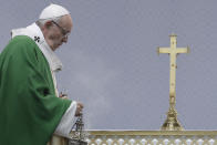 Pope Francis spreads incence on the alter during an open-air Mass at Santakos Park, in Kaunas, Lithuania, Sunday, Sept. 23, 2018. Francis is paying tribute to Lithuanians who suffered and died during Soviet and Nazi occupations on the day the country remembers the near-extermination of its centuries-old Jewish community during the Holocaust. (AP Photo/Andrew Medichini)