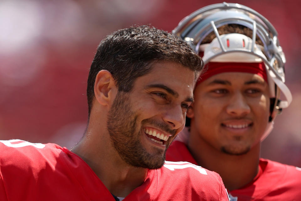 SANTA CLARA, CALIFORNIA - AUGUST 29: Jimmy Garoppolo #10 and Trey Lance #5 of the San Francisco 49ers talk to each other on the sidelines before their preseason game against the Las Vegas Raiders at Levi's Stadium on August 29, 2021 in Santa Clara, California. (Photo by Ezra Shaw/Getty Images)