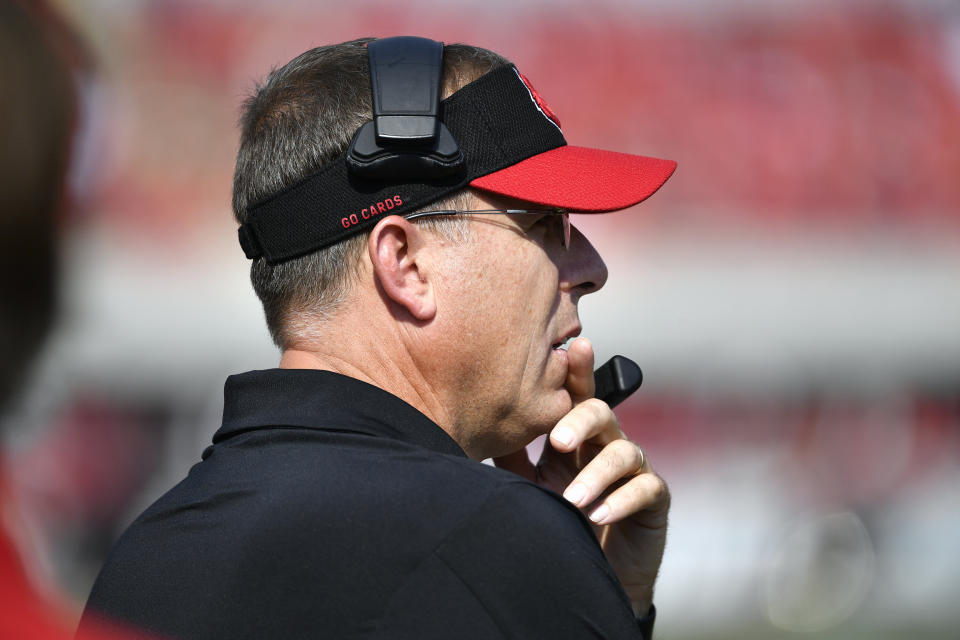 Louisville head coach Scott Satterfield looks out onto the field during the first half of an NCAA college football game against Virginia in Louisville, Ky., Saturday, Oct. 9, 2021. (AP Photo/Timothy D. Easley)