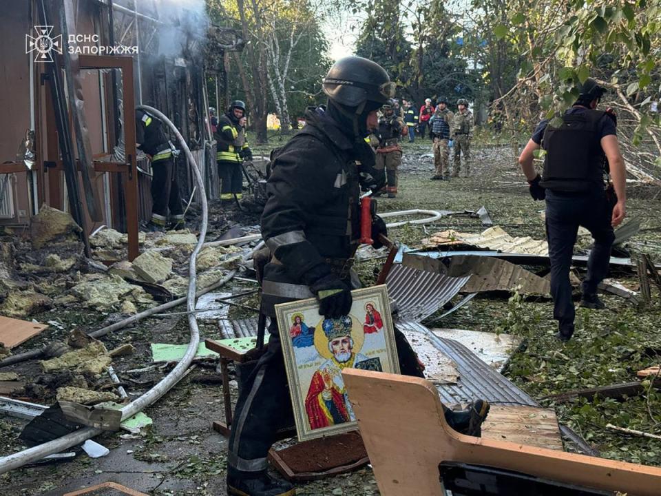 Firefighters at the site of a Russian missile attack on Vilniansk in Ukraine (Ministry of Internal Affairs of Ukraine/AFP)