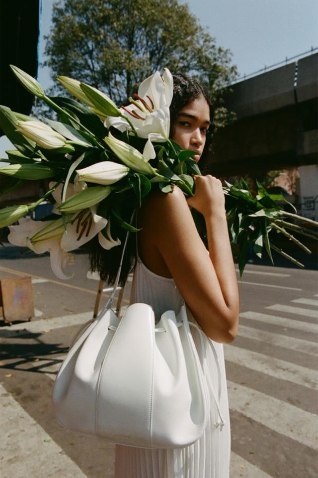 We love: our friend @natalieoffduty with our Large Lilium Bag in Bianca 🤍  Shop the style now on mansurgavriel.com #mansurgavriel