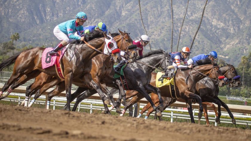 ARCADIA, CALIF. -- FRIDAY, MARCH 29, 2019: Santa Anita Race 6 is off out of the gate as Santa Anita opening day resumes racing at Santa Anita Horse Park in Arcadia, Calif., on March 29, 2019. (Allen J. Schaben / Los Angeles Times)