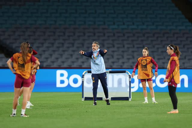 <p>Catherine Ivill/Getty</p> Jorge Vilda, Head Coach of Spain, gives the team instructions during a Spain Training Session during the the FIFA Women's World Cup
