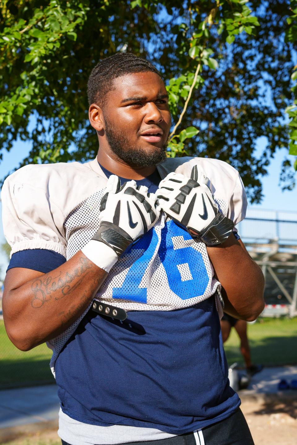 Offensive lineman, Lashown Ealim speaks to a reporter before practice at Chandler High School on Oct. 24, 2022, in Chandler, AZ.