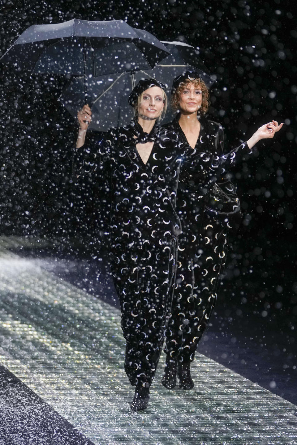 Models wear creations part of the Emporio Armani women's Fall-Winter 2024-25 collection presented in Milan, northern Italy, Thursday, Feb. 22, 2024. (AP Photo/Luca Bruno)