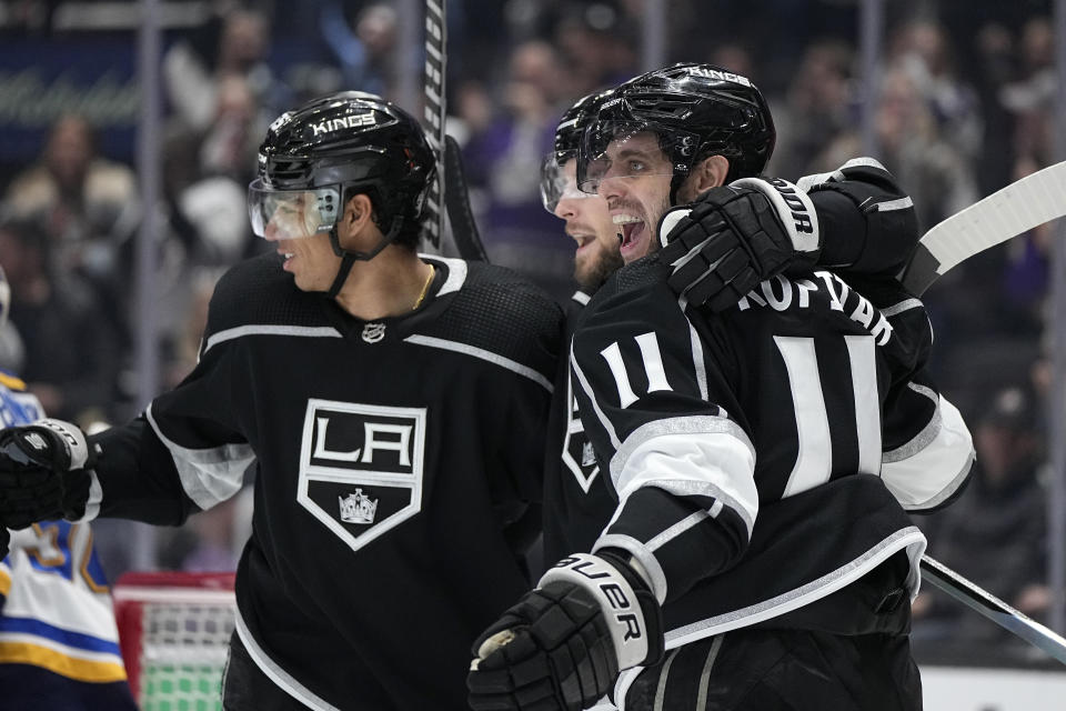 Los Angeles Kings right wing Adrian Kempe, center, celebrates his goal with center Quinton Byfield, left, and center Anze Kopitar during the second period of an NHL hockey game Saturday, March 4, 2023, in Los Angeles. (AP Photo/Mark J. Terrill)