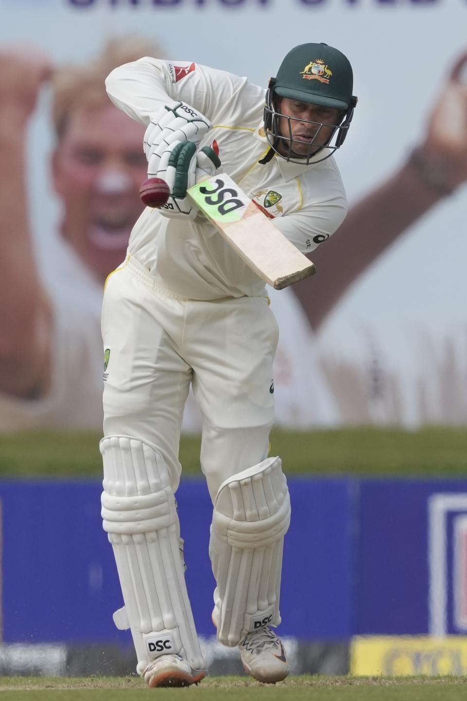 Australia's Usman Khawaja plays a shot during the first day of the second cricket test match between Australia and Sri Lanka in Galle, Sri Lanka, Friday, July 8, 2022. (AP Photo/Eranga Jayawardena)