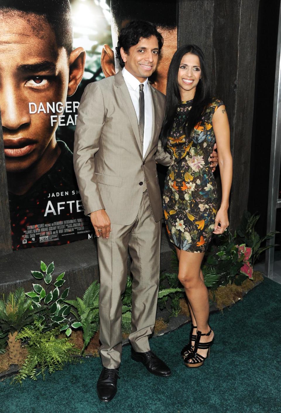 Director M. Night Shyamalan and his wife Bhavna attend the "After Earth" premiere at the Ziegfeld Theatre on Wednesday, May 29, 2013 in New York. (Photo by Evan Agostini/Invision/AP)