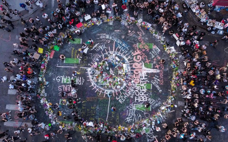 The makeshift memorial is designed to honour George Floyd in a peaceful way - AFP 