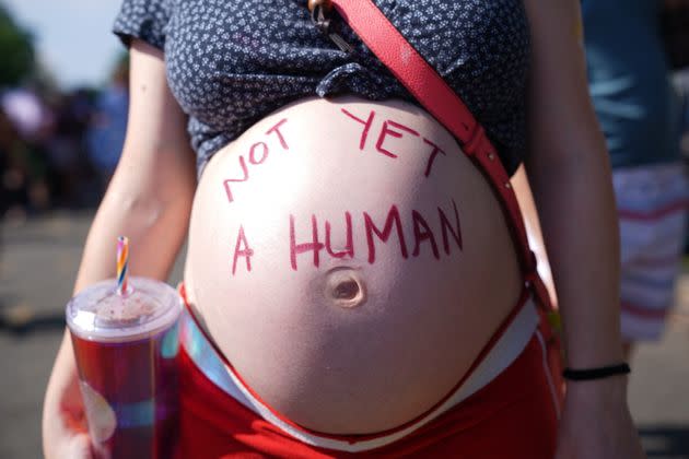 An abortion rights activist stands outside the Supreme Court in Washington. (Photo: STEFANI REYNOLDS/AFP via Getty Images)