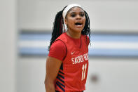 Sacred Heart Academy guard ZaKiyah Johnson shouts during a high school basketball game against Mercy Academy in Louisville, Ky., Sunday, Feb. 11, 2024. The junior wing ranked as a top prospect for next season has pared her initial list down to a dozen schools, a group that includes defending national champion LSU, current No. 1 and two-time champ South Carolina, UConn and nearby Louisville. (AP Photo/Timothy D. Easley)