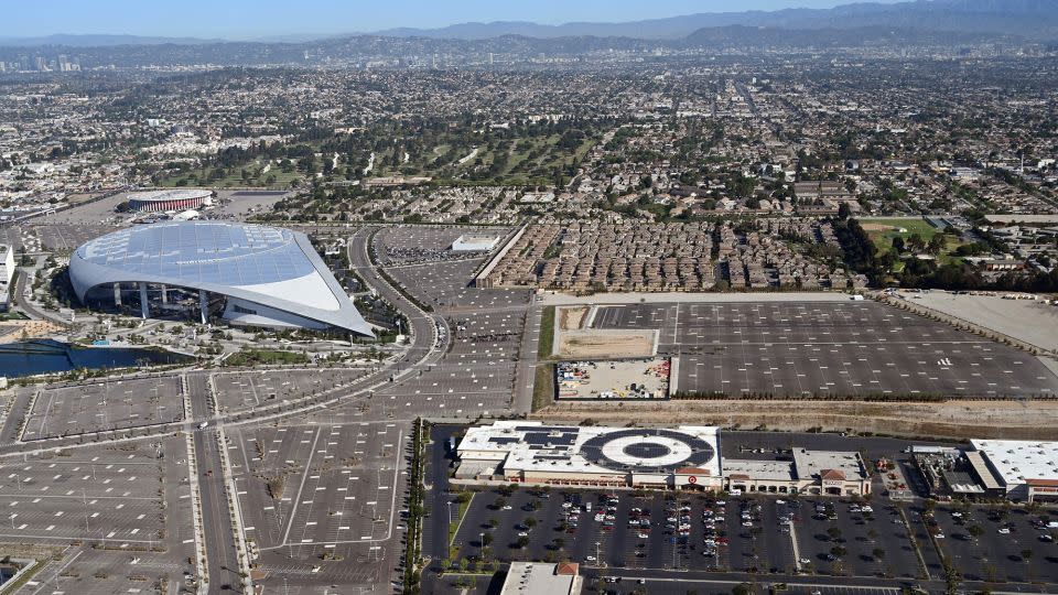 Sofi Stadium in Inglewood, California, surrounded by a shopping mall and housing. - Daniel Slim/AFP/Getty Images